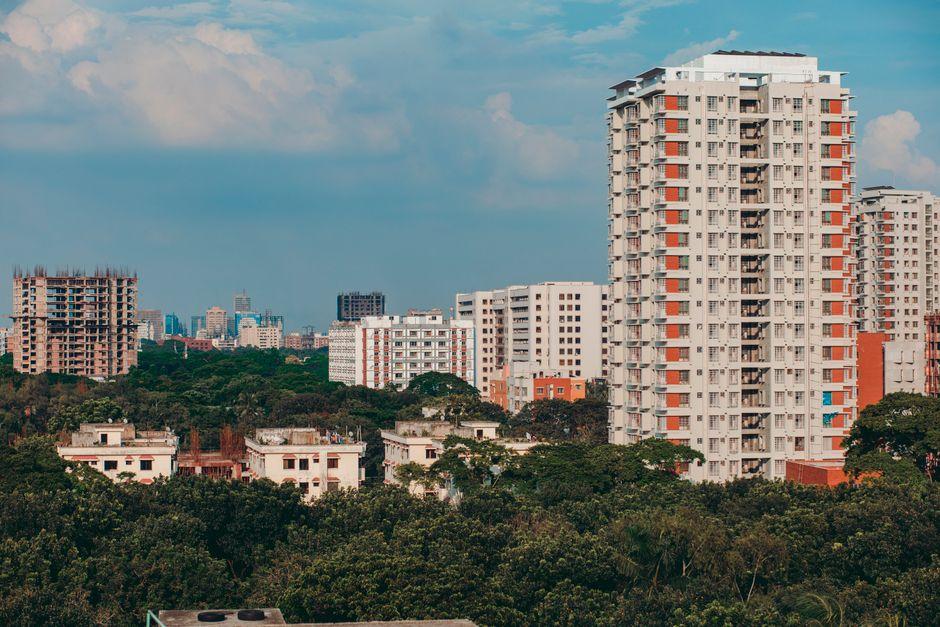 Buildings and Green Trees under Blue Sky